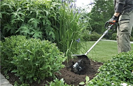 Cultivate the soil with a trimmer attachment