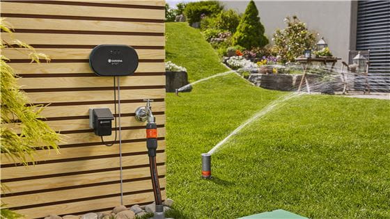 Various GARDENA watering products installed in a garden